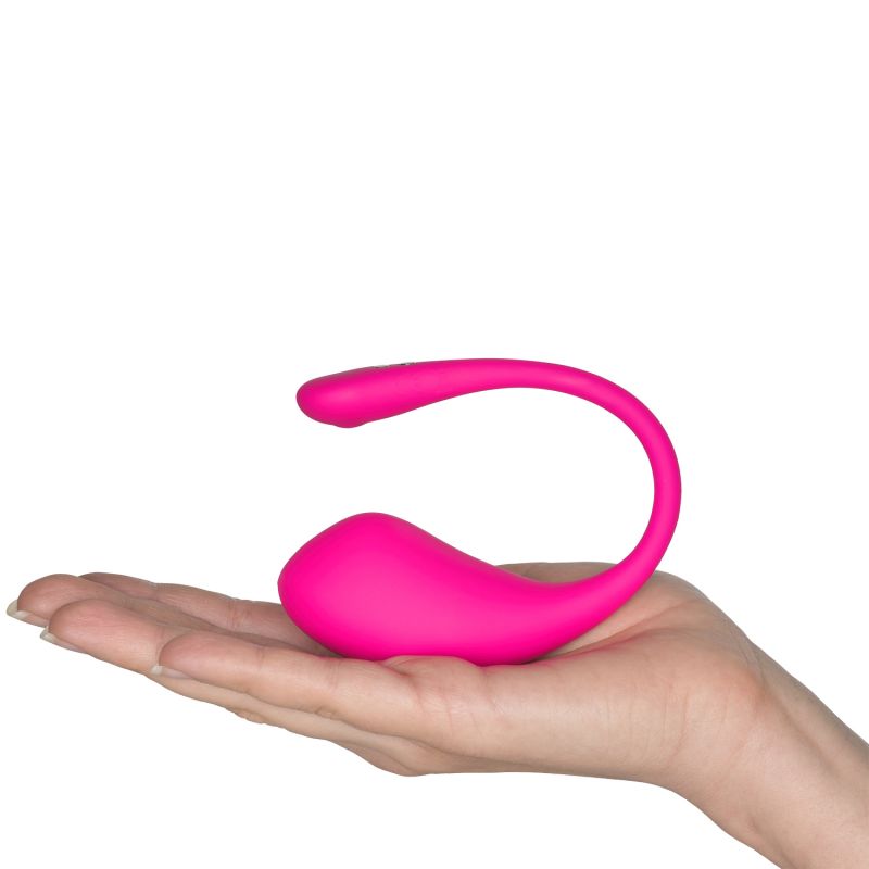 Hand som håller en rosa vibrator